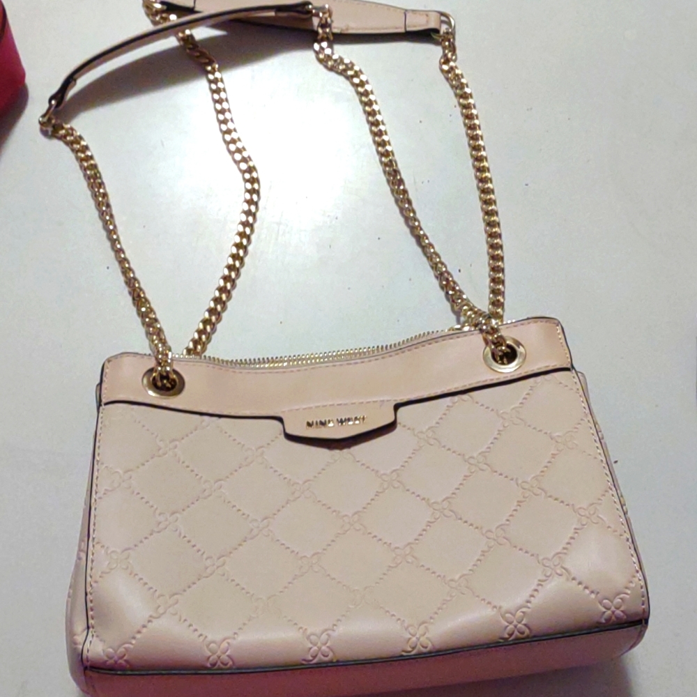 Light pink nine west purse with gold chain